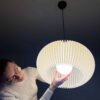 Person installing elegant pendant light
