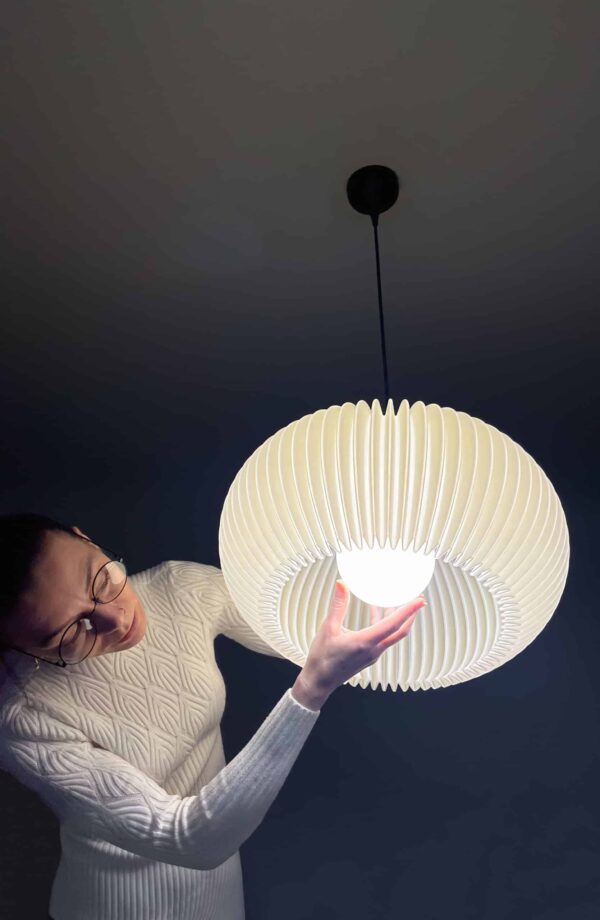 Person installing elegant pendant light