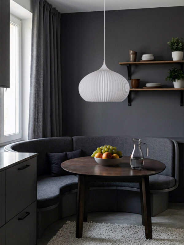 Person holding a white pendant lamp.
