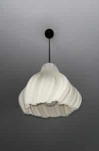Woman holding elegant pendant light
