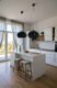 Oval black pendant lights over kitchen island