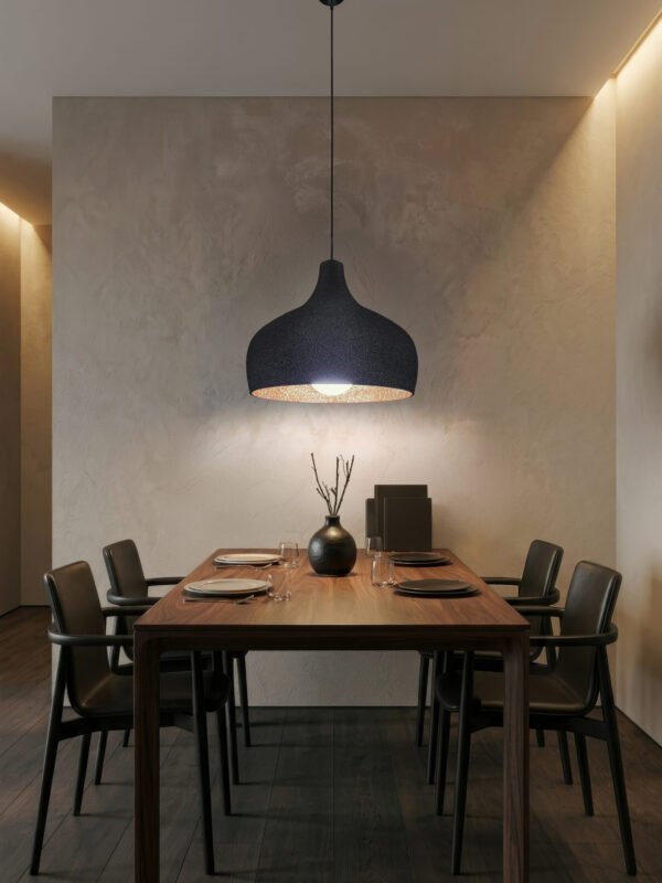 Carbon Black UMBRA pendant lampshade hanging over a kitchen island, volcanic texture exterior